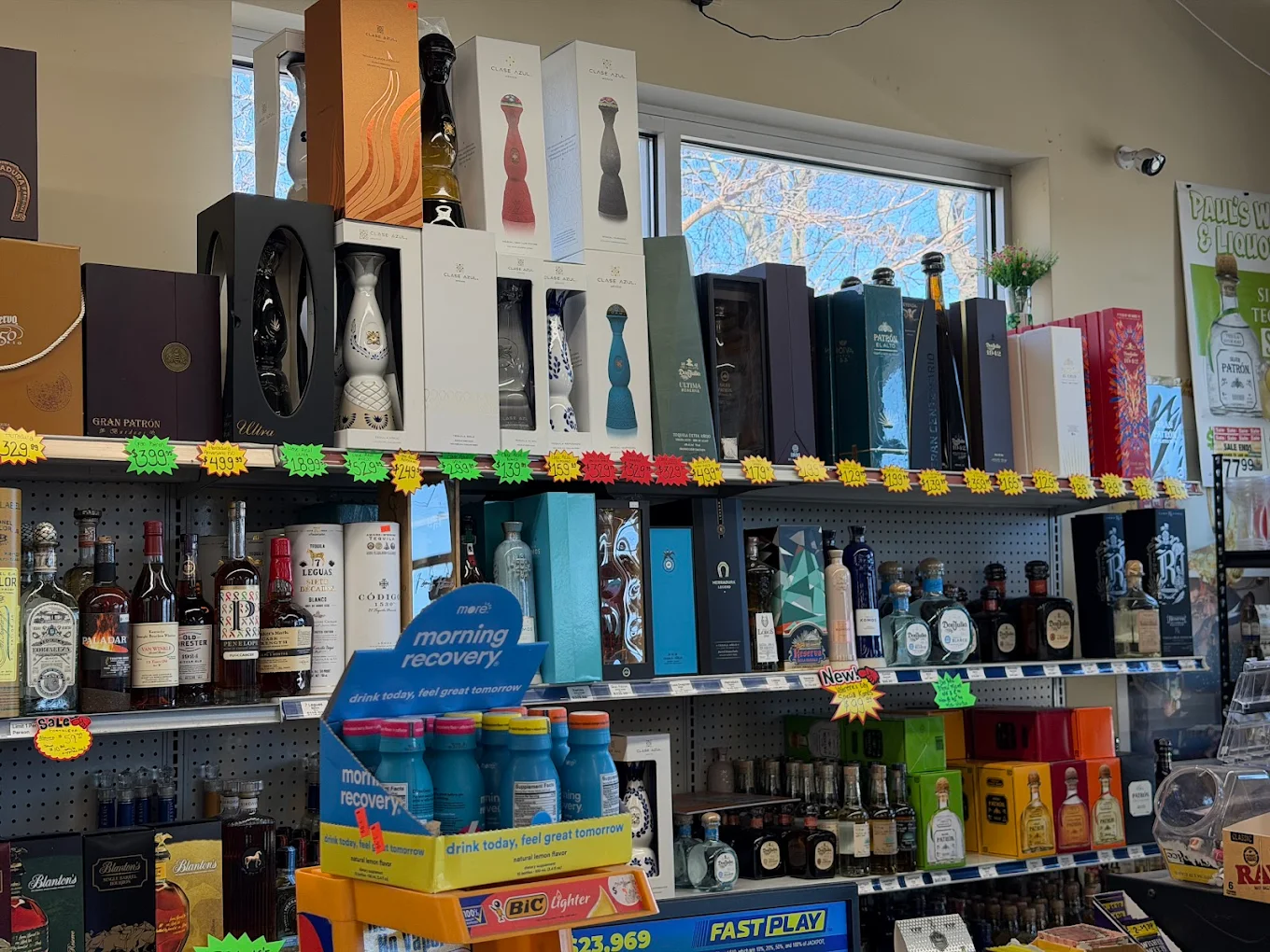 Curated wine bottles on Paul's shelves